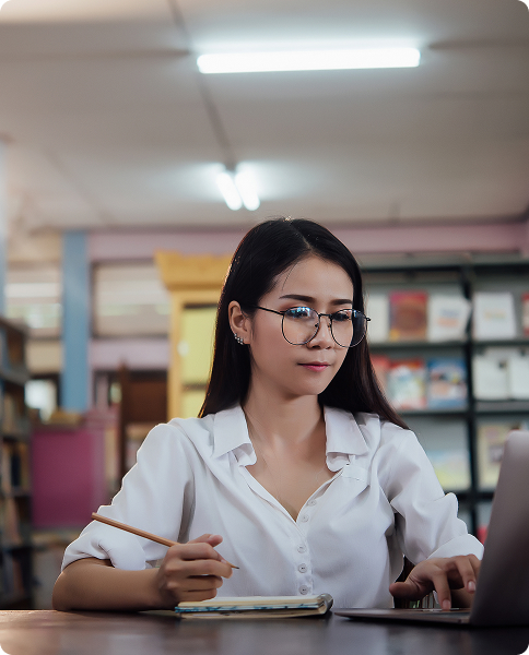 Student focused on studying with a laptop, practicing discipline.