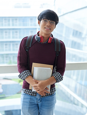 Freshman student holding books